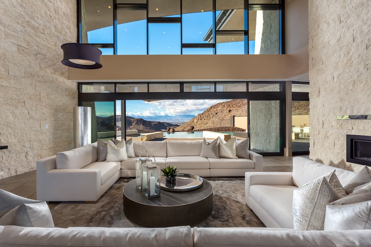Contemporary living room with indoor-outdoor desert views.