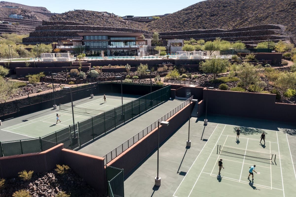 Tennis courts in upscale residential community with mountain views.