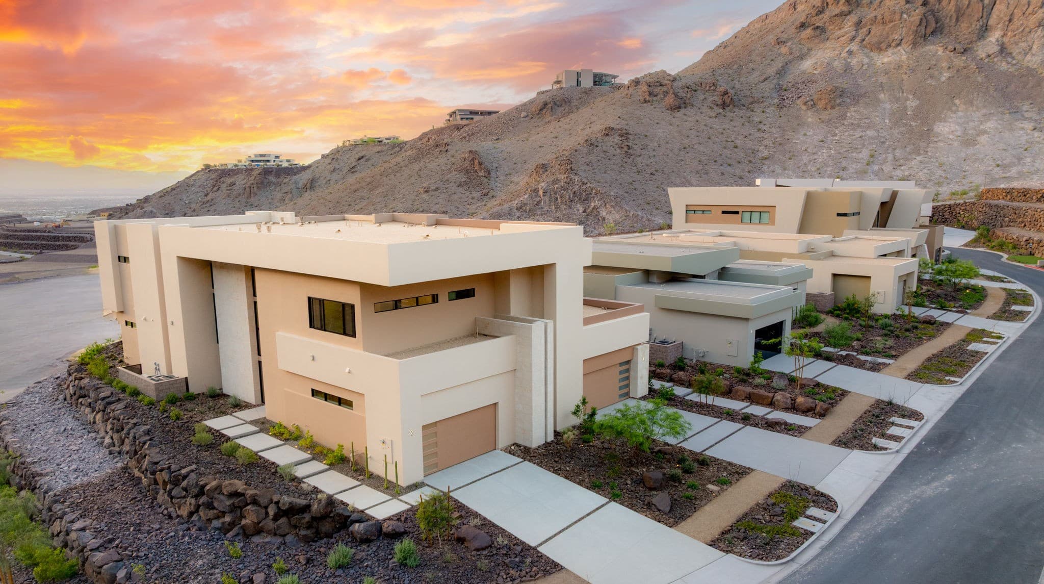 Modern luxury residence with contemporary architecture, open-concept living spaces, high-end finishes, expansive windows, and seamless indoor-outdoor design set against scenic desert mountain views.