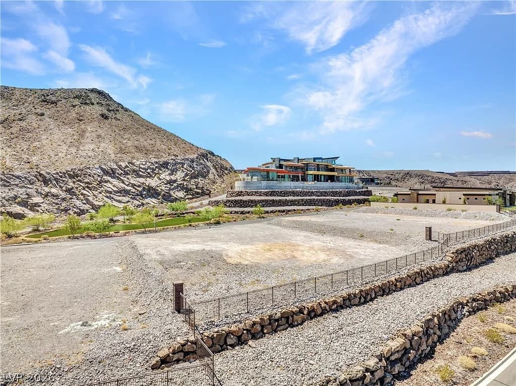 Estate homesite at Ascaya with neighboring custom homes and panoramic mountain views overlooking the Las Vegas Valley.