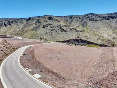 Aerial view of homesite lot outlined within a desert mountainside community development