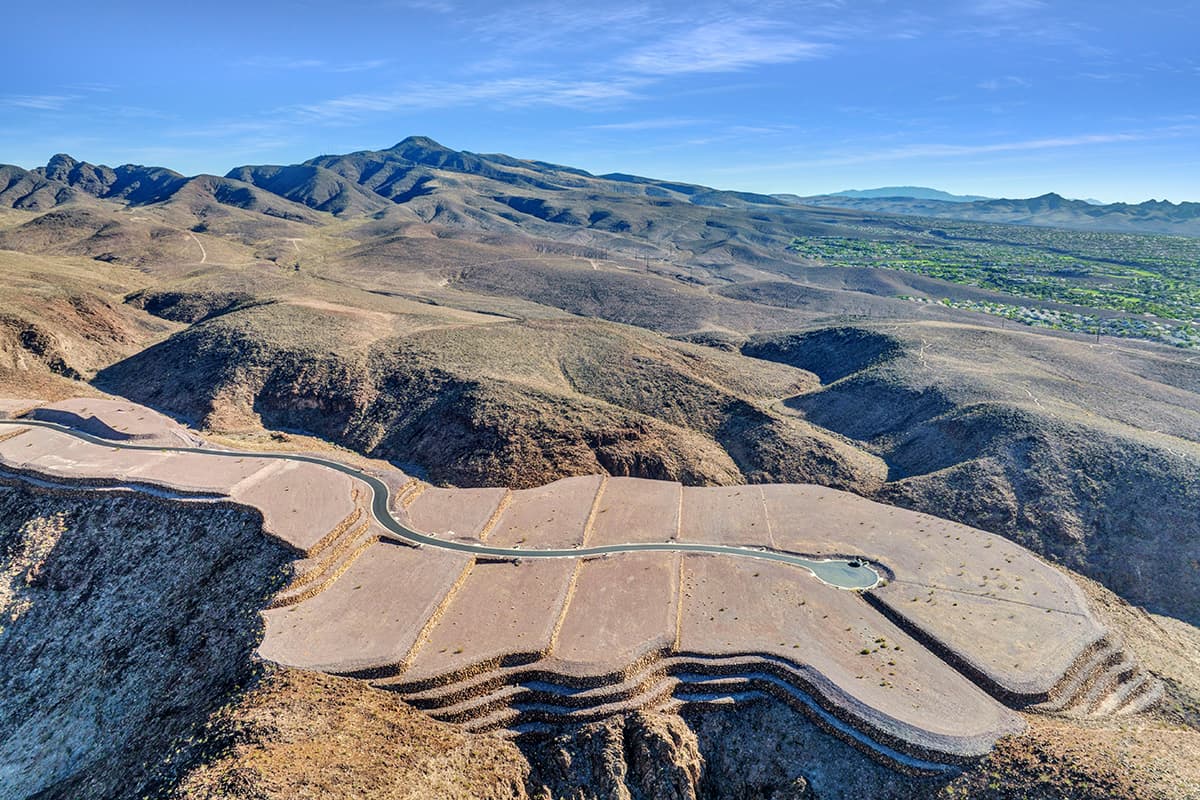 Aerial view of luxury homesites in Ascaya surrounded by the McCullough Mountain range