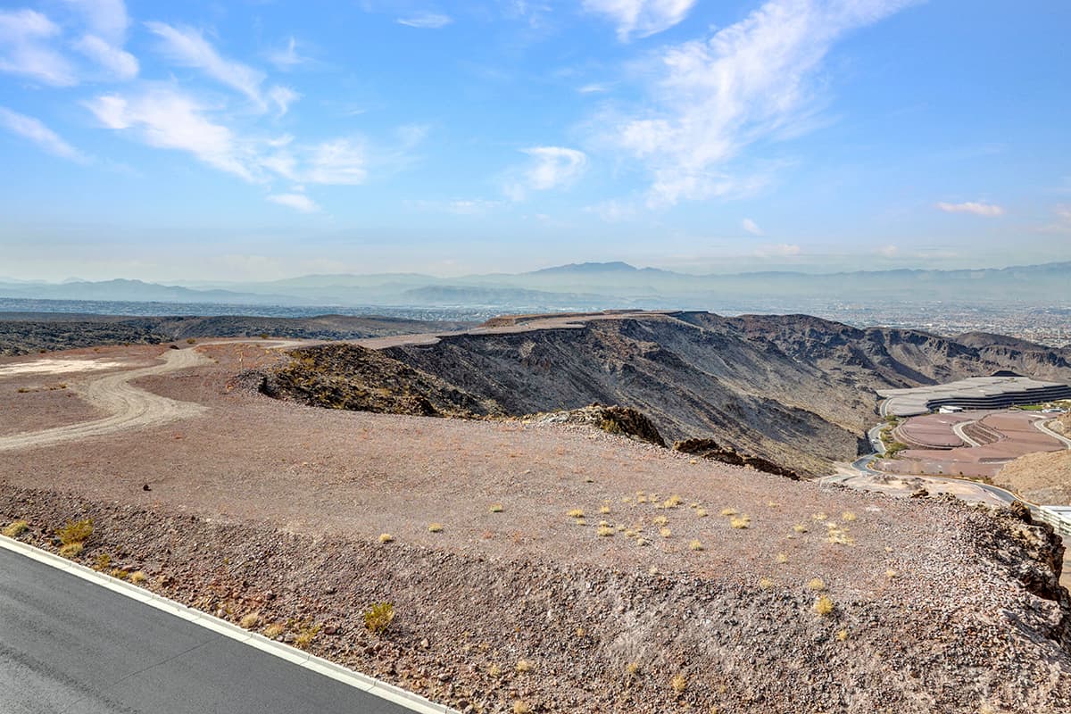 Panoramic Las Vegas Strip and mountain views from a premium desert hillside homesite in an exclusive luxury community.