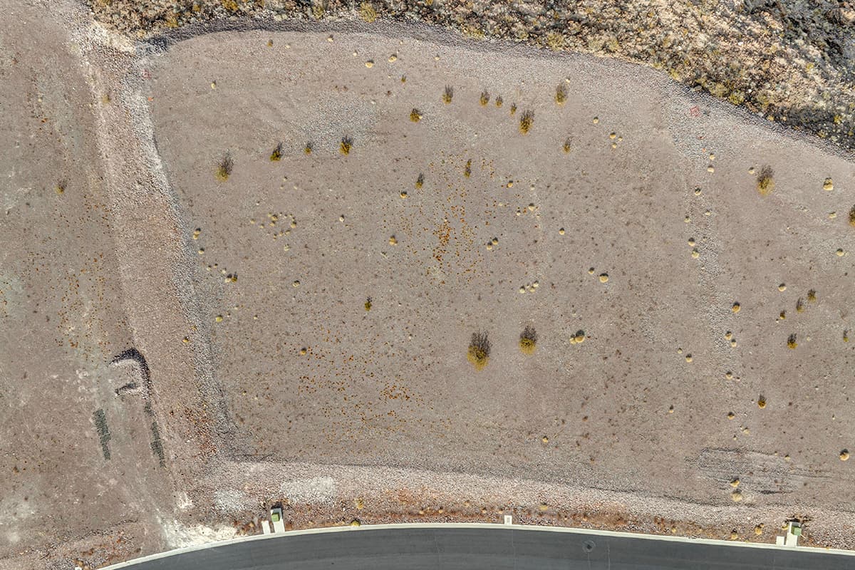 Aerial view of premium desert homesite on cul-de-sac in luxury Las Vegas hillside community.