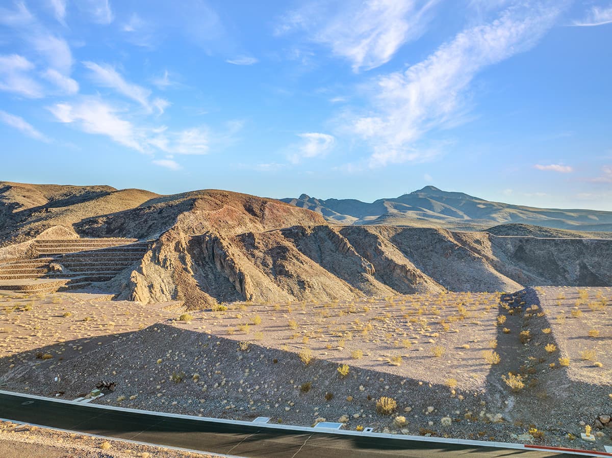 Spectacular Ascaya homesite with sweeping desert canyon views, sculpted mountain ridgelines, and serene open skies in a secluded hillside setting