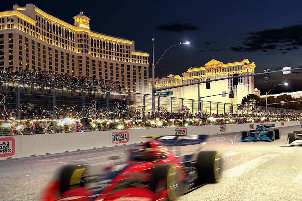 High-speed Formula 1 action racing through the iconic Las Vegas Strip at night.
