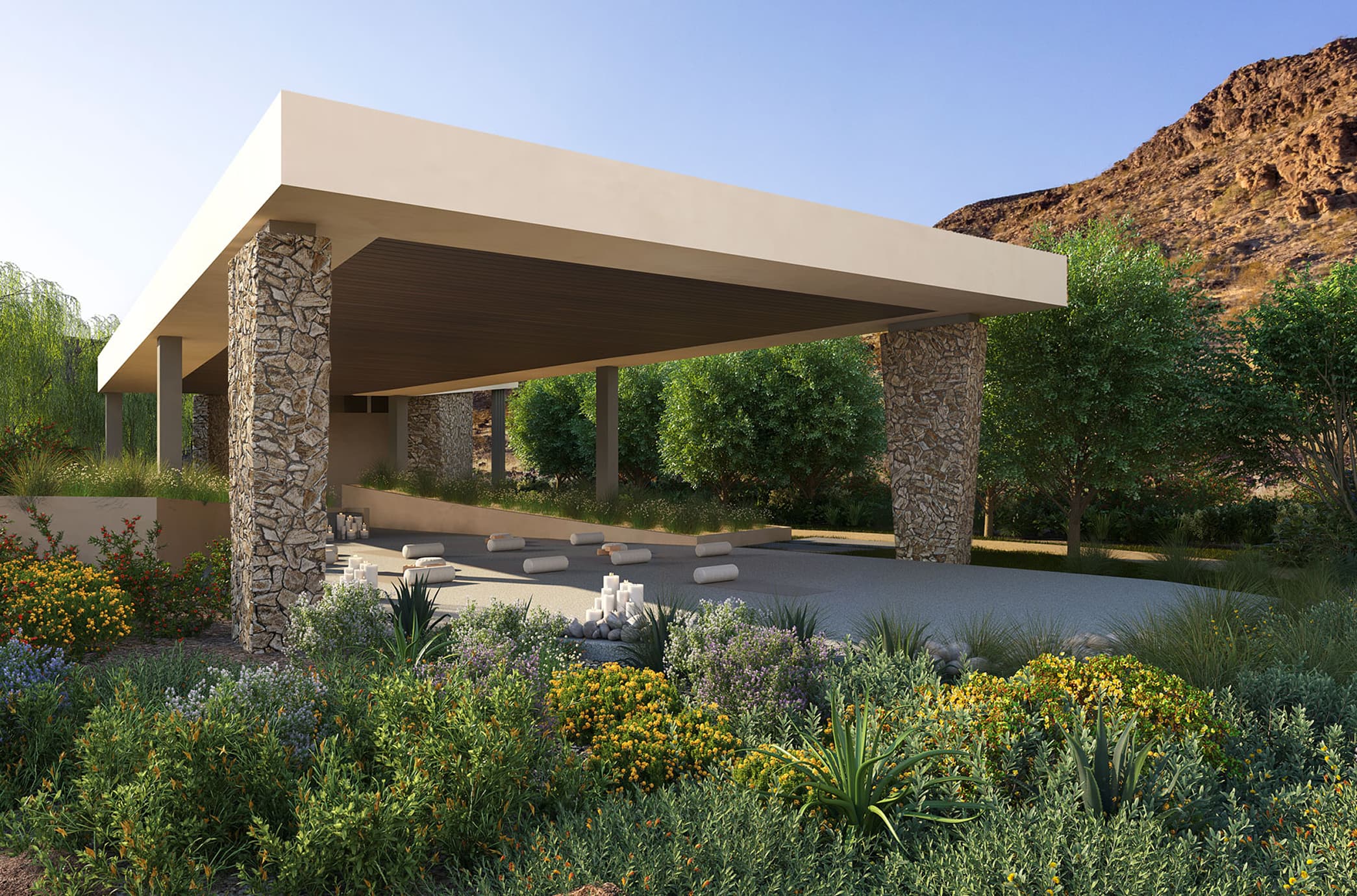 Modern outdoor yoga pavilion with stone columns, landscaped garden, and serene desert setting.
