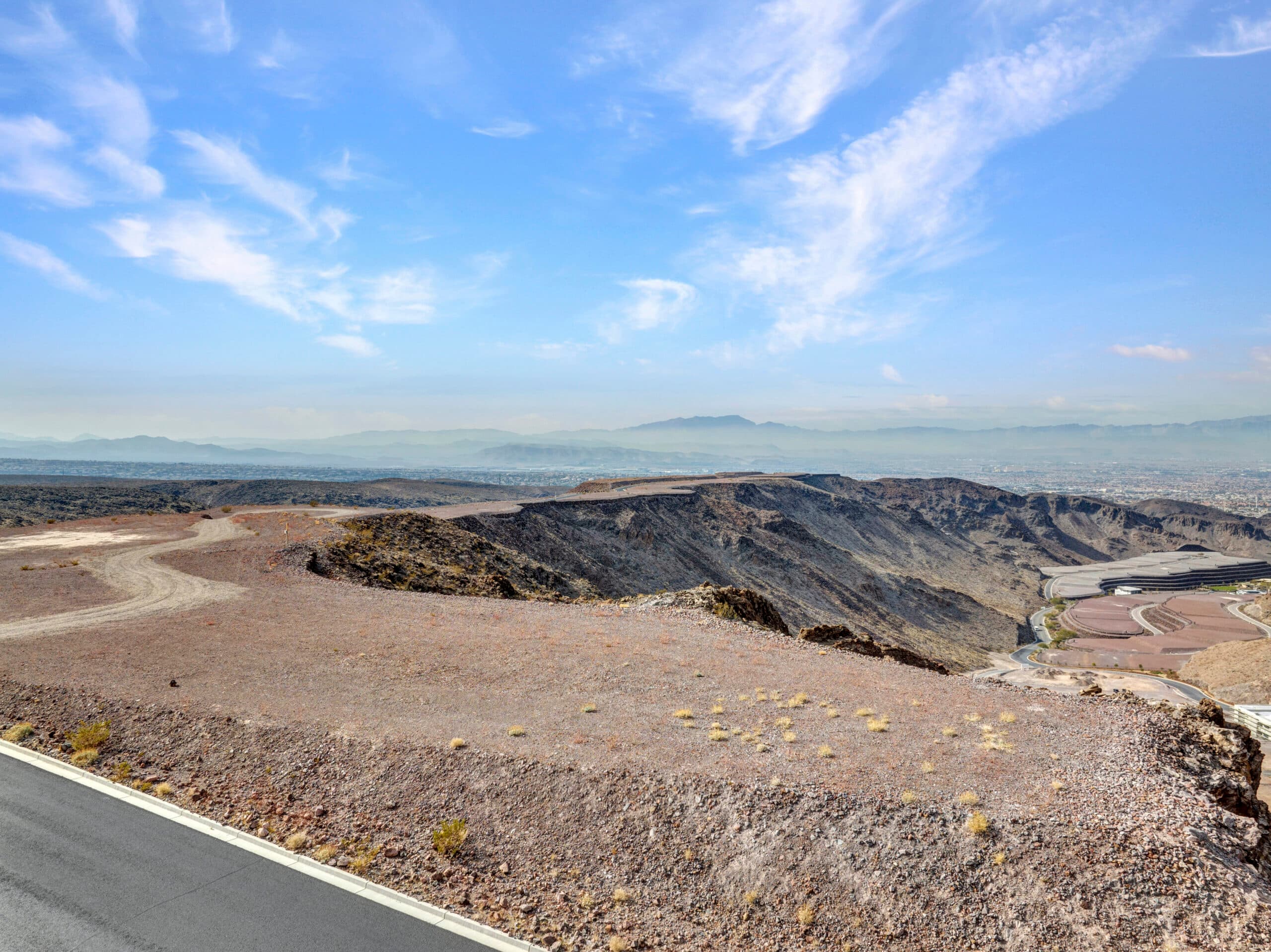 Panoramic Las Vegas Strip and mountain views from a premium desert hillside homesite in an exclusive luxury community.