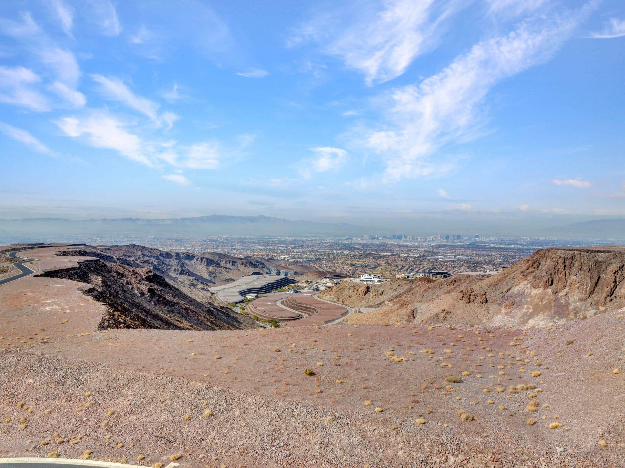 Panoramic Las Vegas Strip and mountain views from a premium desert hillside homesite in an exclusive luxury community.