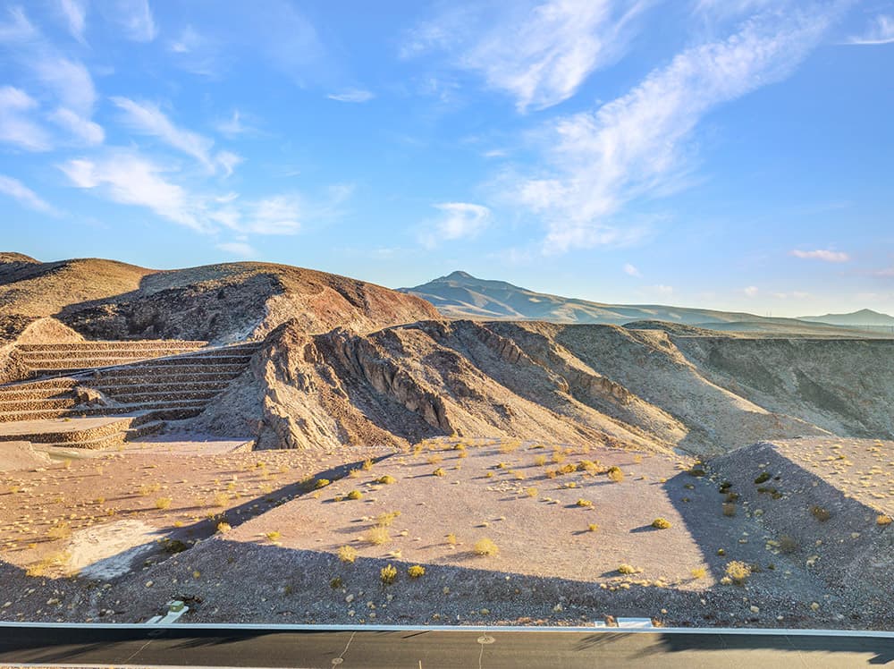 Private Ascaya homesite overlooking rugged desert canyons and layered mountain ridges with expansive Nevada sky views