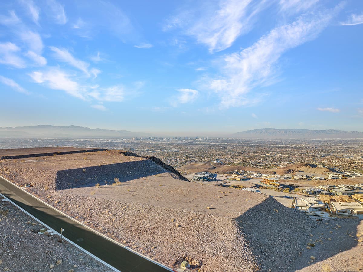 Premier Ascaya homesite showcasing elevated Las Vegas Strip views, expansive desert surroundings, and breathtaking mountain panoramas from a private hillside setting