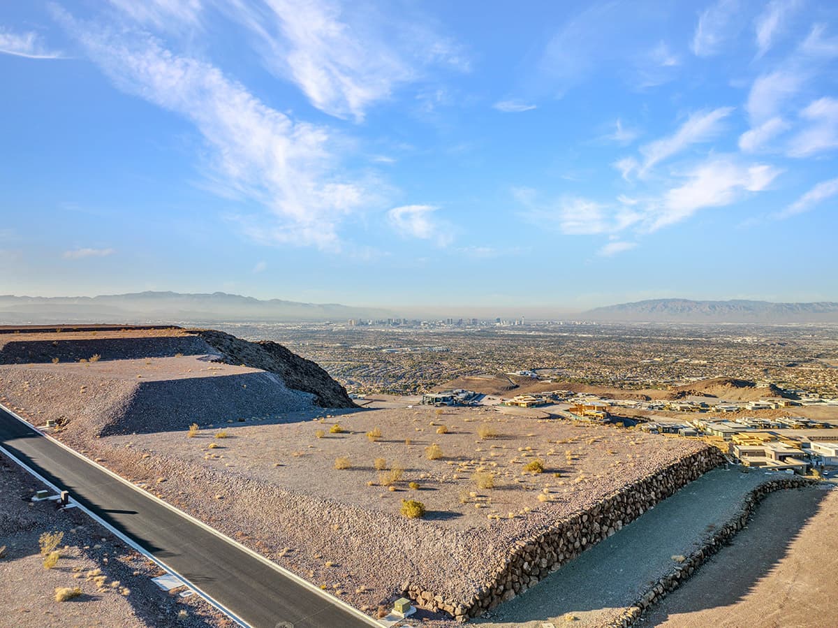 Exclusive Ascaya homesite with commanding Las Vegas skyline views, elevated desert terrain, and expansive mountain backdrops in a prestigious hillside enclave
