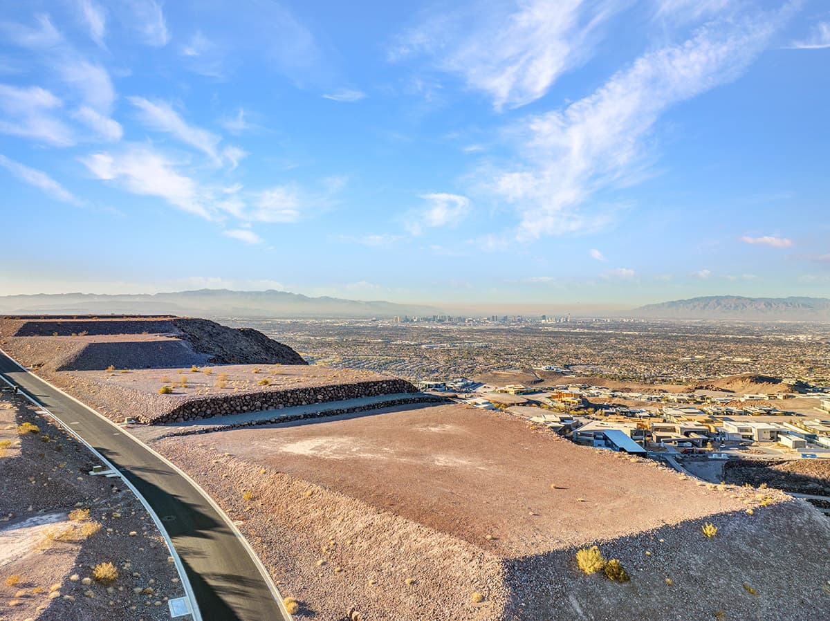 Ultra-exclusive Ascaya homesite featuring panoramic Las Vegas Strip views, elevated desert landscapes, and sweeping mountain vistas from a premier ridge-top location