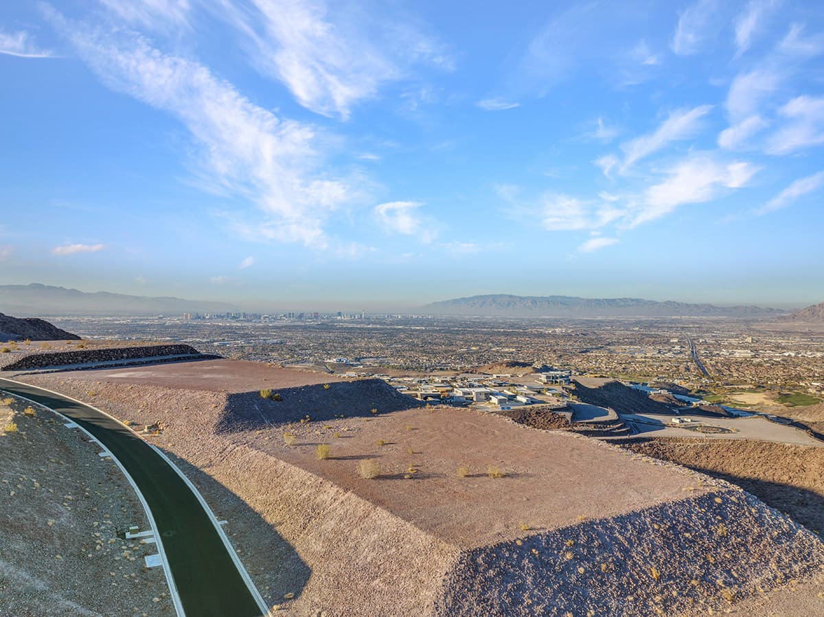 Premier Ascaya homesite offering unobstructed Las Vegas Strip views, dramatic elevated desert terrain, and expansive mountain panoramas from a secluded hillside setting