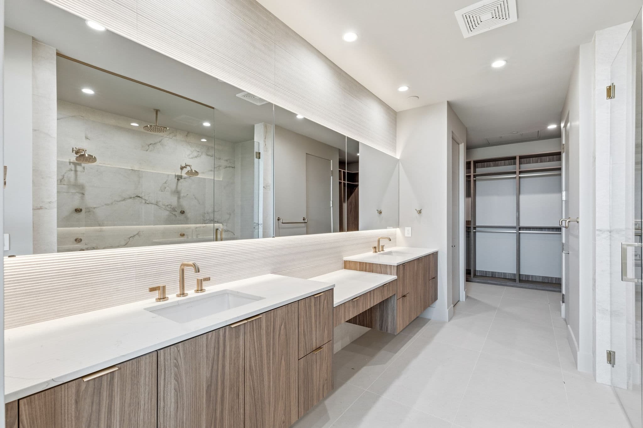 Modern luxury residence with contemporary architecture, open-concept living spaces, high-end finishes, expansive windows, and seamless indoor-outdoor design set against scenic desert mountain views.