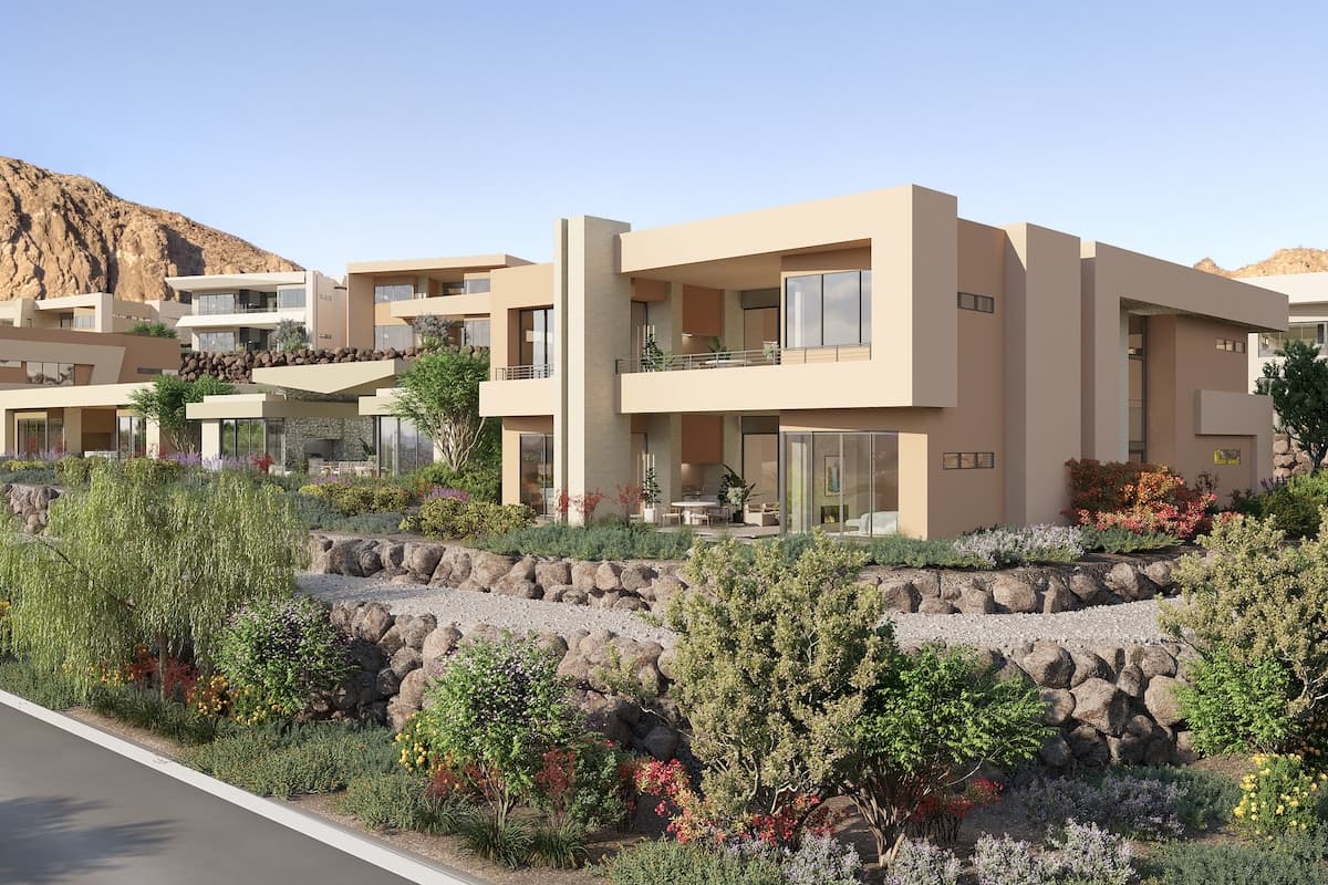 Contemporary desert residence with clean lines, landscaped garden, and neighboring modern homes on a hillside.